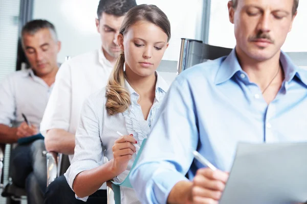 Taking notes at a seminar — Stock Photo, Image