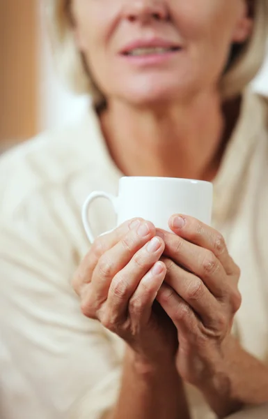 Drinking hot beverage — Stock Photo, Image