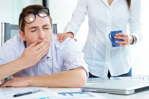 Yawning in the office — Stock Photo, Image