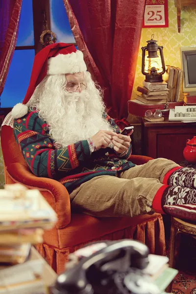 Santa Claus and smartphone — Stock Photo, Image