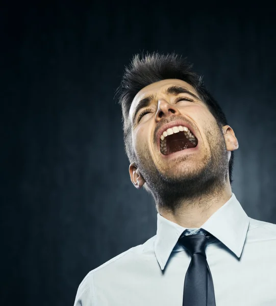 Angry young businessman — Stock Photo, Image