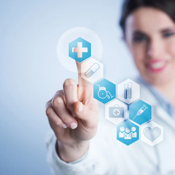 Young female doctor using touch screen interface. — Stock Photo, Image