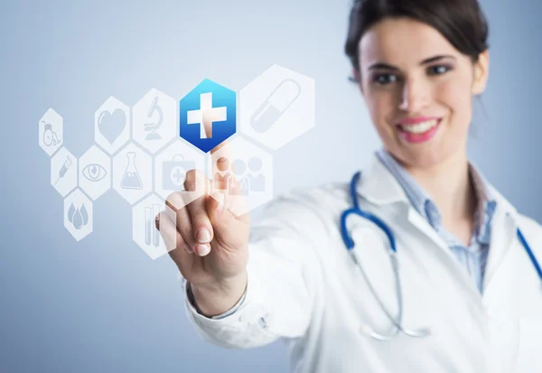 Young female doctor using touch screen interface. — Stock Photo, Image