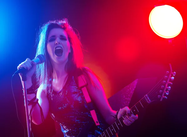 Rock star singing on stage — Stock Photo, Image