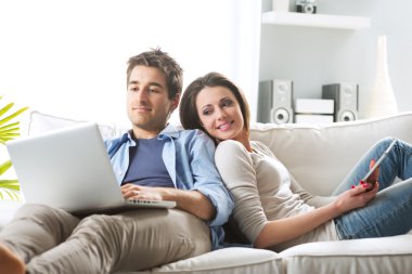 Couple surfing the net at home