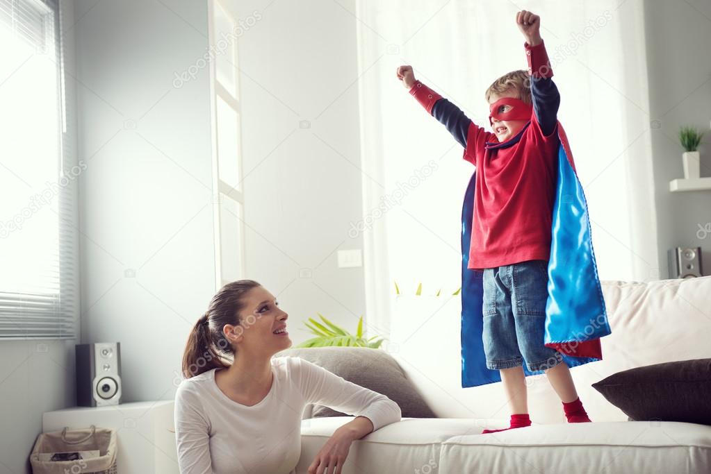 Little superhero with his mother