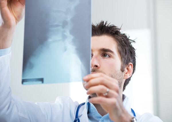 Radiologist examining an X-ray image