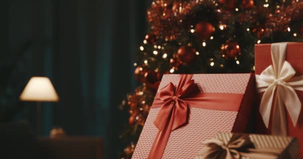 Gifts and Christmas tree at home — Stock Video