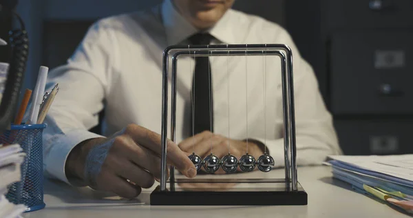 Businessman Working Late Night Office Staring Netwon Cradle Balls Swinging — Stock Photo, Image