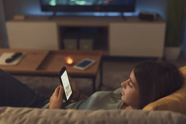 Adolescent Cute Girl Lying Couch Home Connecting Online Her Smartphone — Foto Stock