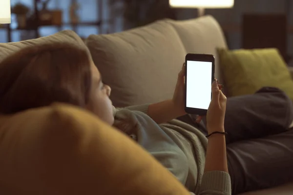 Girl Relaxing Home She Lying Couch Connecting Online Her Smartphone — Zdjęcie stockowe