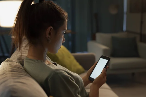 Teenager Relaxing Couch Home Connecting Online Using Her Smartphone Screen — Zdjęcie stockowe