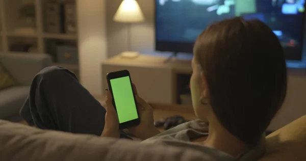 Girl Sitting Couch Home Connecting Online Her Smartphone — Stockfoto