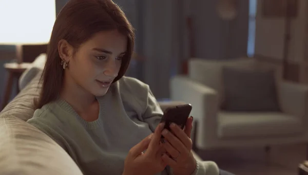 Smiling Teenager Relaxing Sofa Connecting Online Her Smartphone She Social — Foto de Stock