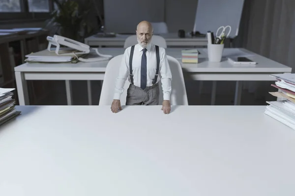 Funny Tiny Business Executive Standing His Chair Leaning Huge Desk — Photo