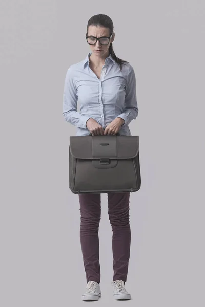Young Shy Businesswoman Standing Holding Her Briefcase Isolated Gray Background — 图库照片