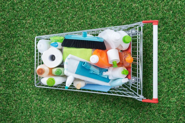 Shopping Cart Full Detergents Housekeeping Equipment Fresh Grass Top View — Stock Photo, Image