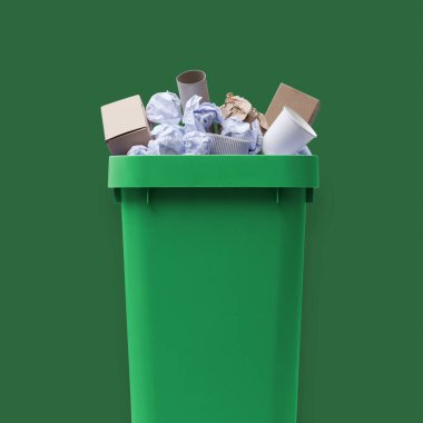 Çöp tenekesi kağıt atığı, geri dönüşüm ve atık toplama konseptiyle dolu.