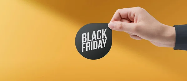 Hand Holding Black Friday Promotional Label Sales Offers Concept — 스톡 사진