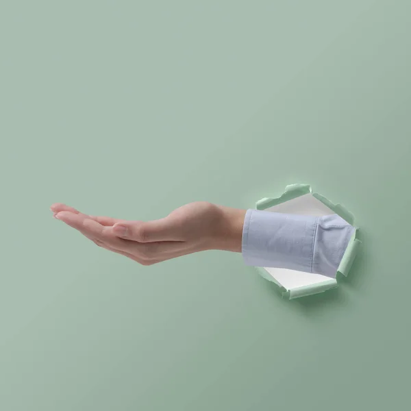 Outstretched Female Hand Torn Paper Help Assistance Concept — Stock Photo, Image