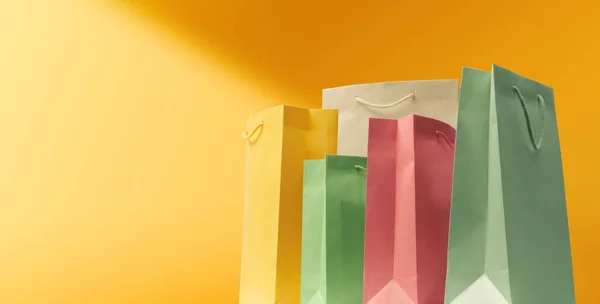 Collection Assorted Shopping Bags Yellow Background Sales Shopping Banner — Zdjęcie stockowe