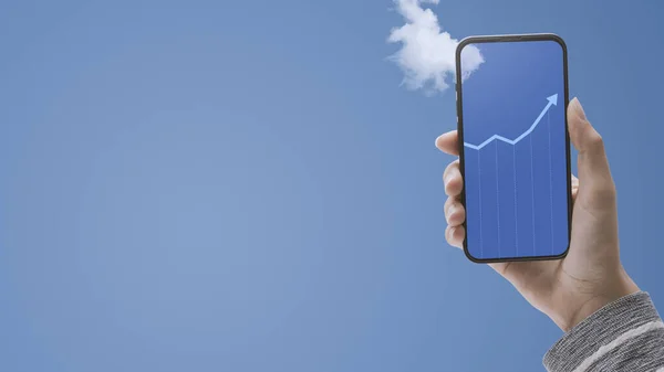 Hand Holding Smartphone Financial Chart Showing Growth Display Blue Sky — Stock Photo, Image