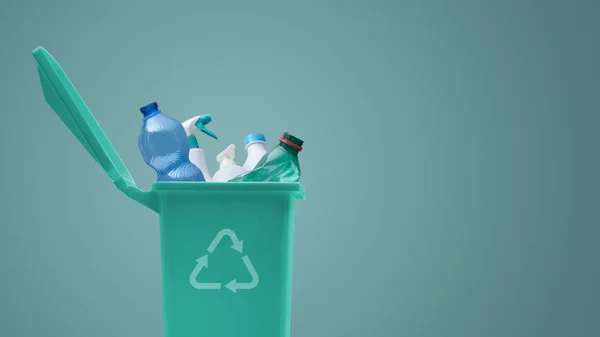 Recycling bin full of plastic waste, separate waste collection concept