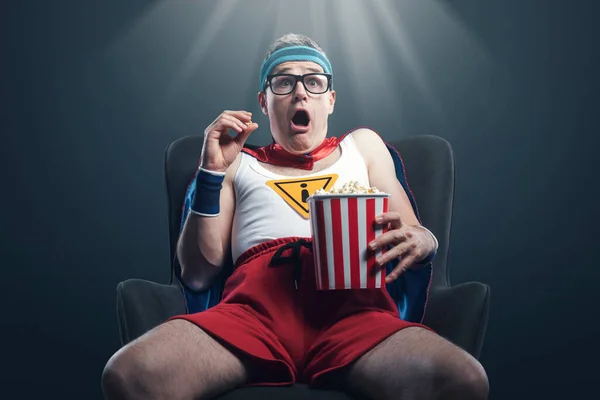 Funny Superhero Watching Horror Movies Eating Popcorn Terrified — Stockfoto