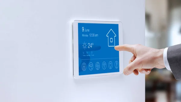 Man Checking Smart Home Touch Screen Control Panel Home Automation — Stok fotoğraf