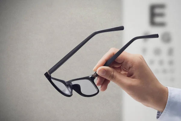 Professional Optometrist Holding Glasses Eye Chart Background Eyesight Vision Problems — Stock fotografie
