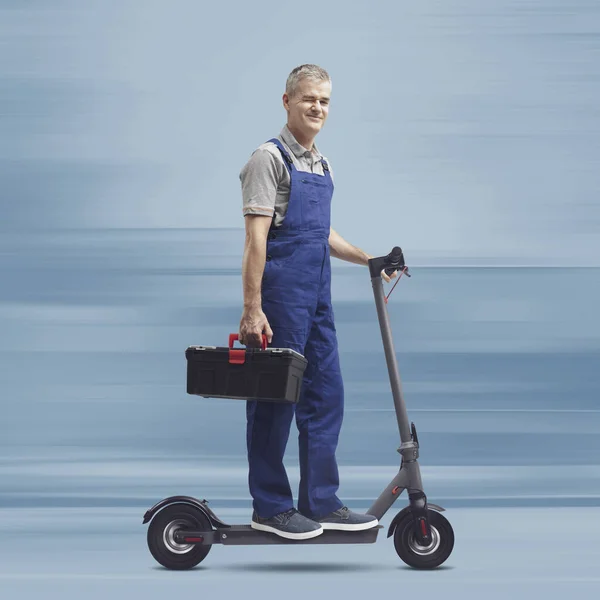 Professional Fast Repairman Riding Electric Scooter Winking Express Repair Service — Stock Photo, Image