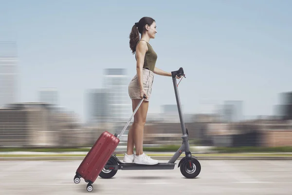 Young Woman Riding Electric Scooter Travelling City She Carrying Trolley — Stock Photo, Image
