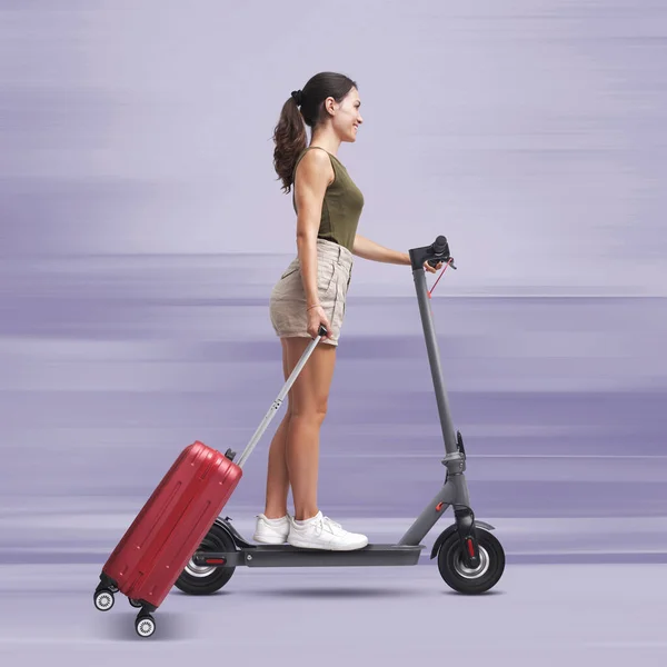 Tourist Woman Riding Fast Electric Scooter Carrying Trolley Bag Sustainable — Stock Photo, Image