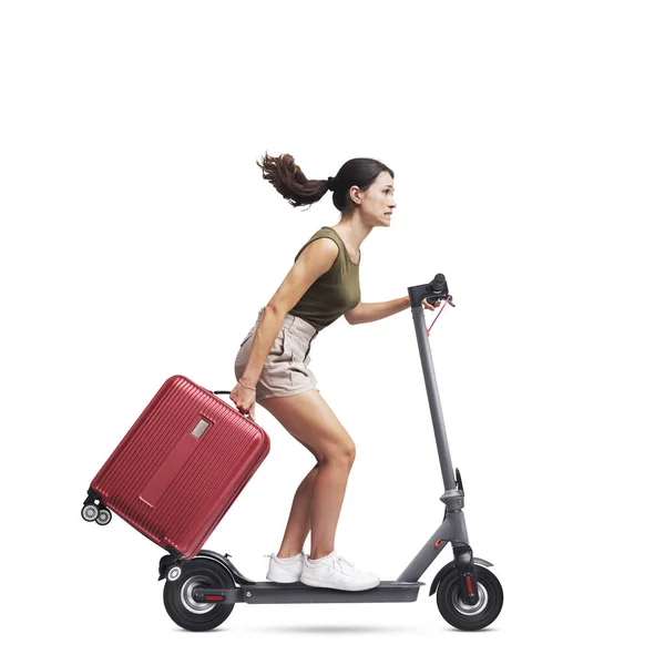 Young Woman Carrying Trolley Bag Riding Fast Electric Scooter Sustainable — Stock Photo, Image