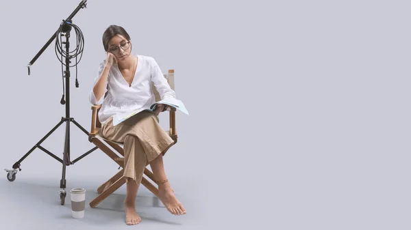 Focused Film Director Sitting Director Chair Reading Play Script Copy — Stock Photo, Image