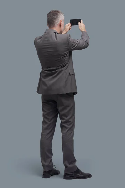 Corporate Businessman Taking Pictures Sharing Online His Smartphone Back View — Stock Photo, Image