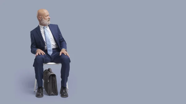 Surprised Corporate Businessman Sitting Chair Looking His Side Waiting Meeting — Stock Photo, Image