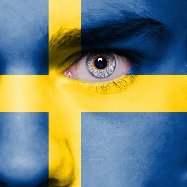 Sweden flag painted on face — Stock Photo, Image