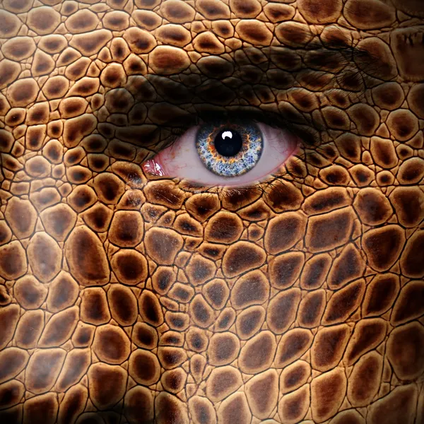 Lizard skin pattern on man face — Stock Photo, Image