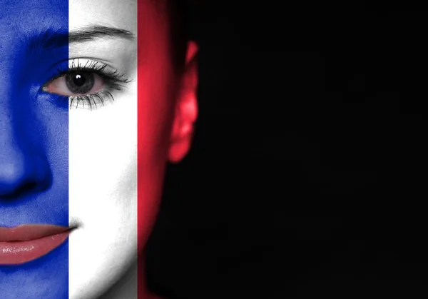 Cara de mujer pintada con bandera de Francia — Foto de Stock