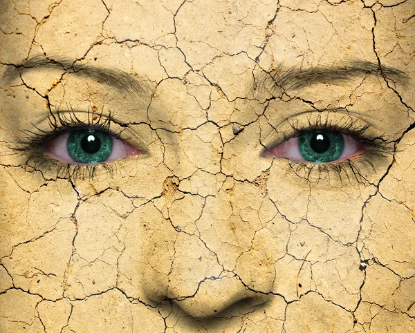 Woman face with cracked earth pattern — Stock Photo, Image