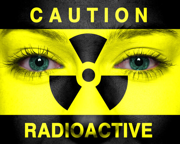 Radioactive sign painted on a woman face
