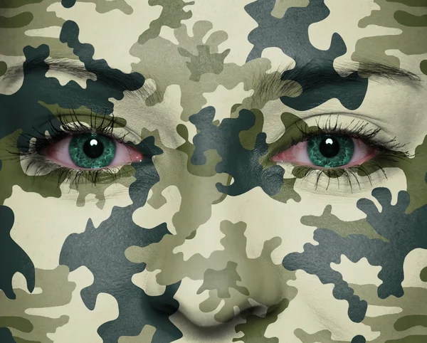 Woodland camouflage painted on woman a face — Stock Photo, Image