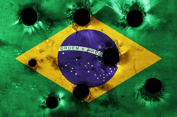 Grunge flag of Brazil with bullet holes — Stock Photo, Image