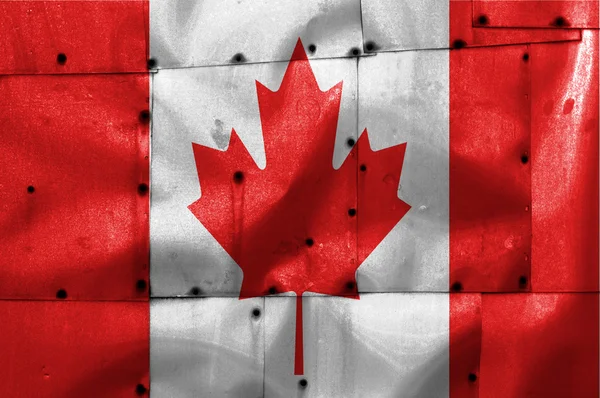 Canada flag on old plane metal plate — Stockfoto