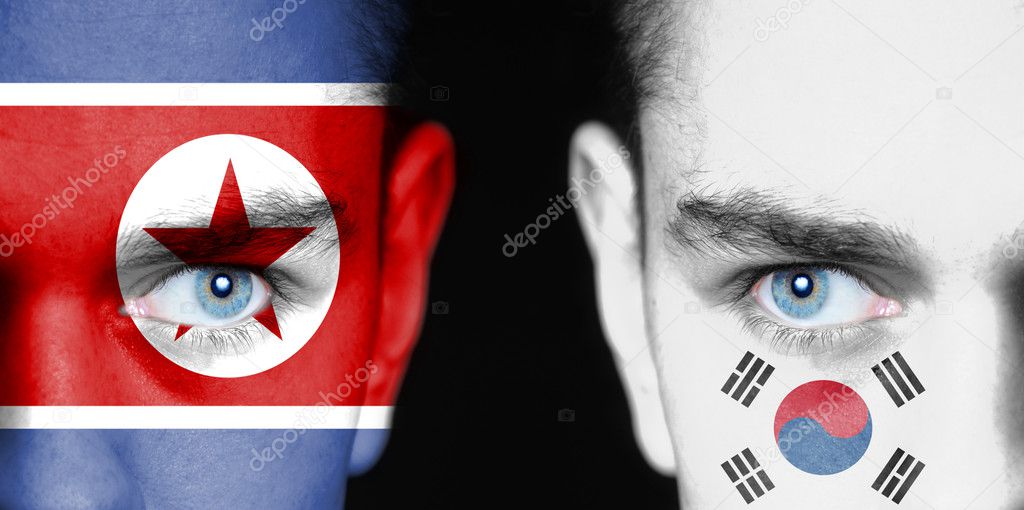 North and South Korea. Flag painted on angry faces