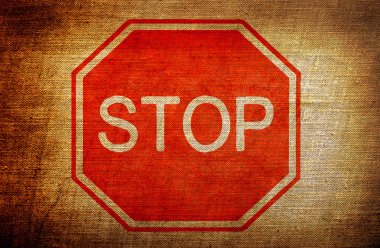 Stop sign on grunge background