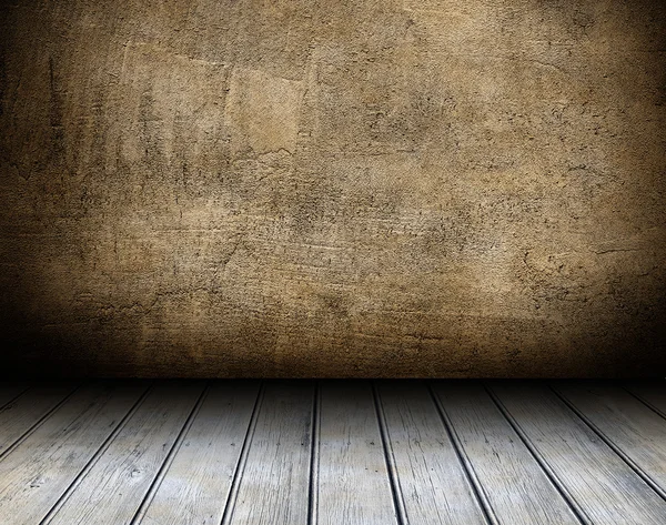 Empty wooden table and dark brown wall in background — Stock Photo, Image