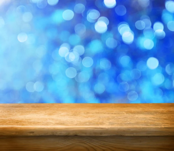 Empty table with winter bokeh background