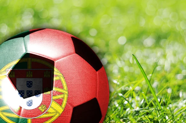 Футбольный мяч с флагом Португалии — стоковое фото